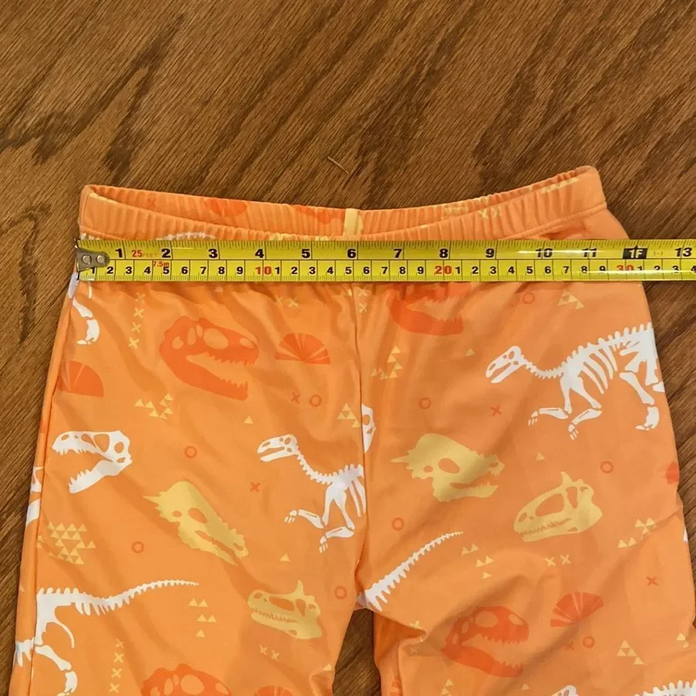 NWOT boys or girls swim shorts size 152 which is an 11/12 - dinosaurs, orange